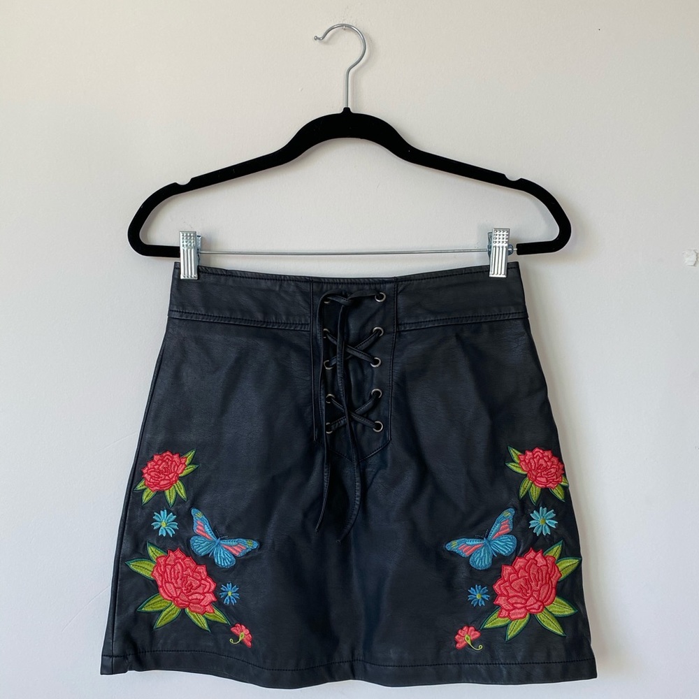 Black leather lace up miniskirt with embroidery